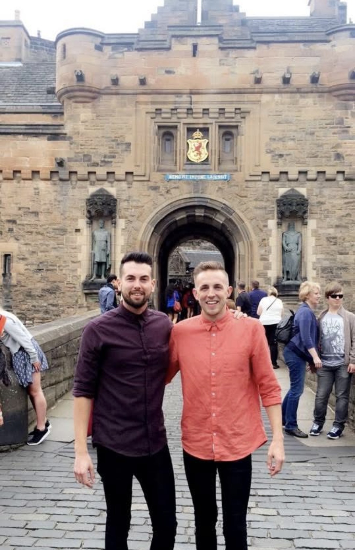 Mark and Mikey arm in arm outside the gates of Edinburgh Castle